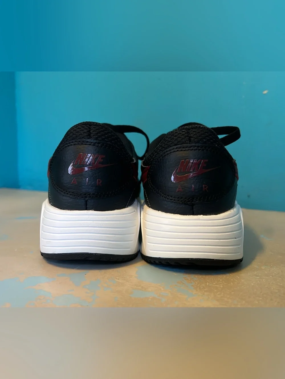 Nike Black Sneakers with Burgundy Swoosh and White Midsole